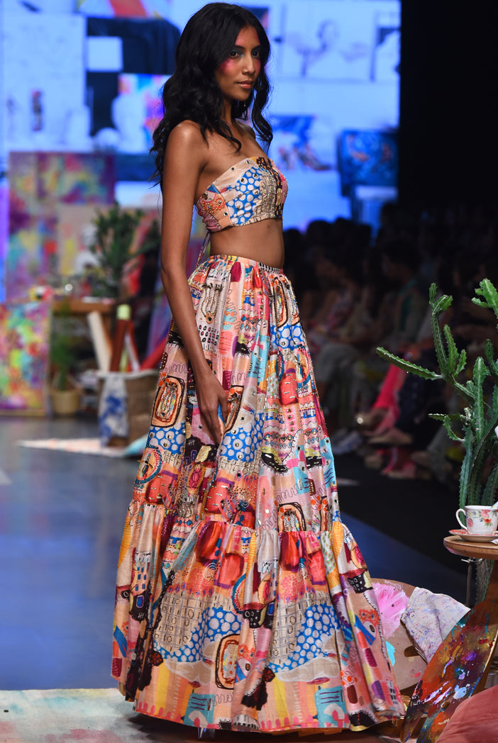 Trance Print Dupion Silk Embroidered Bustier With Embroidered Frill Hem Lehenga And A Peach Mukaish Net Dupatta With Tassels