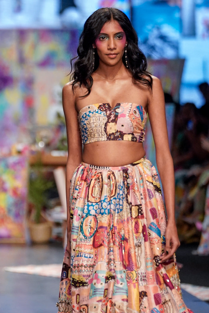 Trance Print Dupion Silk Embroidered Bustier With Embroidered Frill Hem Lehenga And A Peach Mukaish Net Dupatta With Tassels