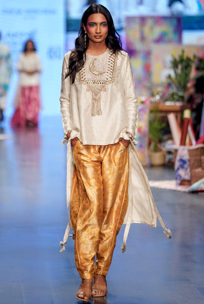 Off white abla silk embroidered high low kurta with mustard brocade constructed pants. - The Grand Trunk