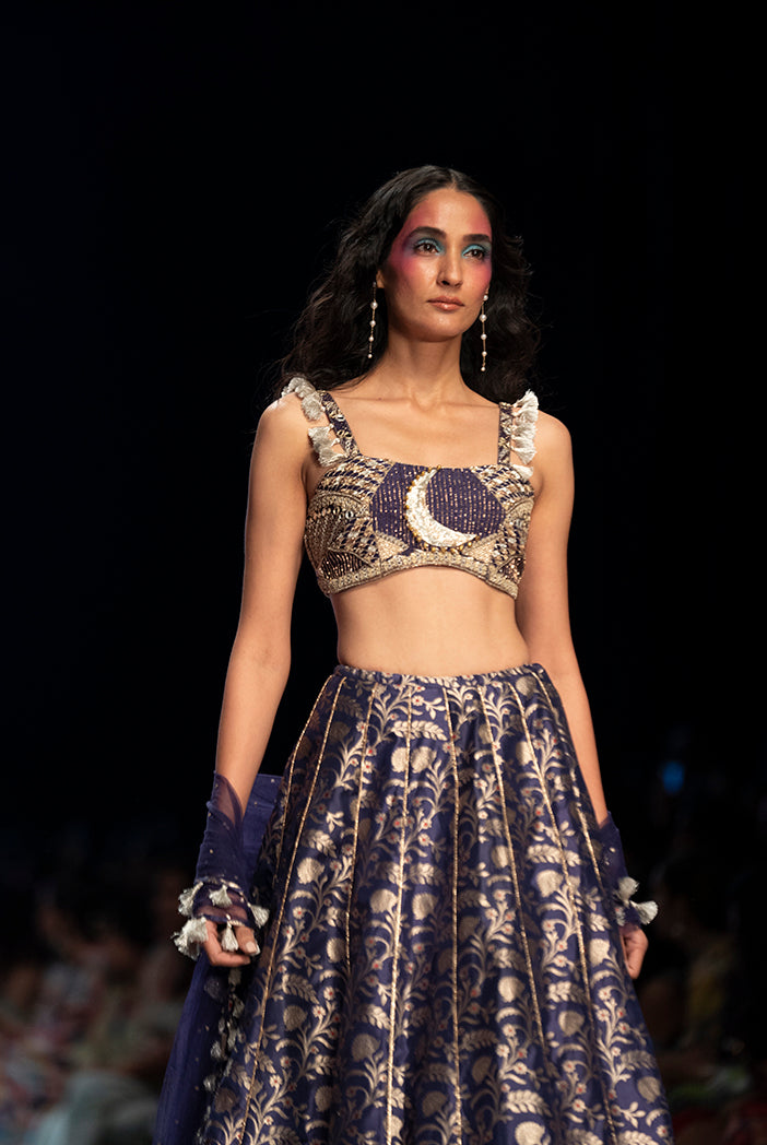 Navy dupion brocade silk embroidered bustier with brocade scalloped hem lehenga and mukaish net dupatta. - The Grand Trunk