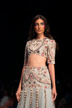 Load image into Gallery viewer, Powder blue velvet embroidered choli with a velvet basque organza skirt and mukaish net dupatta. - The Grand Trunk