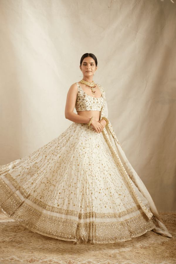 Astha Narang White With Gold Jaal Work Lehenga Set - The Grand Trunk Astha Narang White With Gold Jaal Work Lehenga Set - The Grand Trunk