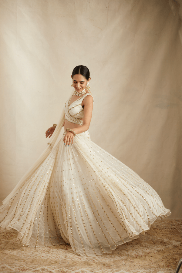 Astha Narang White With Gold Work Lehenga Set - The Grand Trunk Astha Narang White With Gold Work Lehenga Set - The Grand Trunk