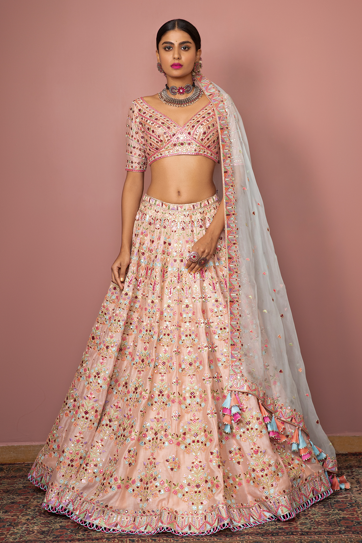 BLUSH PEACH HEAVILY EMBROIDERED LEHENGA SET WITH RESHAM MIRROR, - The Grand Trunk